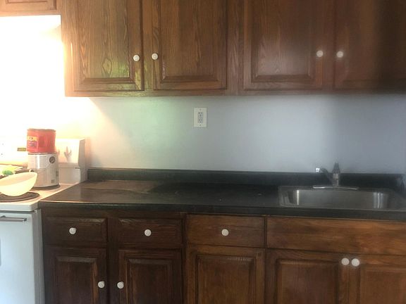 Kitchen Includes stove and refrigerator. Ceramic tile floor.