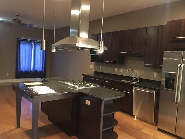Spacious Kitchen with Granite Countertops & Stainless Steel
