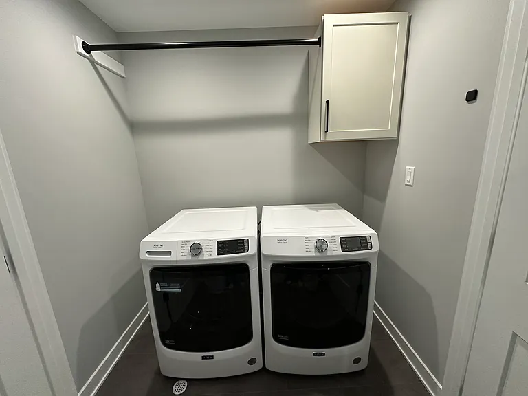 Upstairs laundry room with washer and dryer
