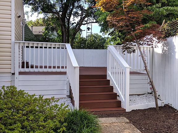 Stairs from carport to rear deck of house