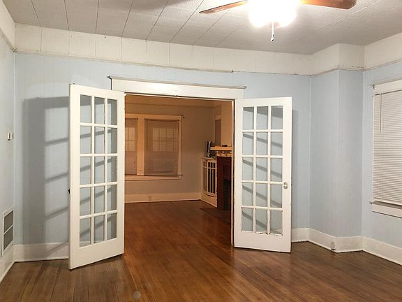 Large dining room with French doors to the living room.