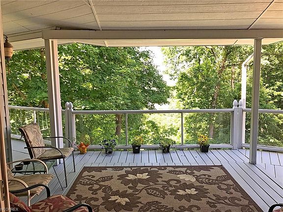 Open porch view to Ohio River and wooded area