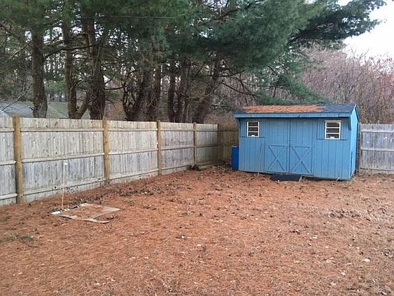 Shed with self propelled lawn mower and other yard maintenance equipment included