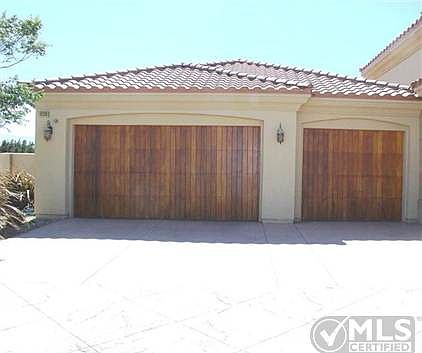 3-car garage with garage door openers on both doors. Beautiful custom garage doors.