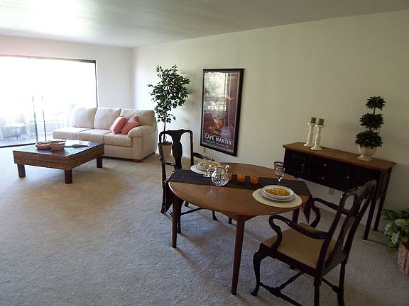 Dining Area and Living Room to Balcony