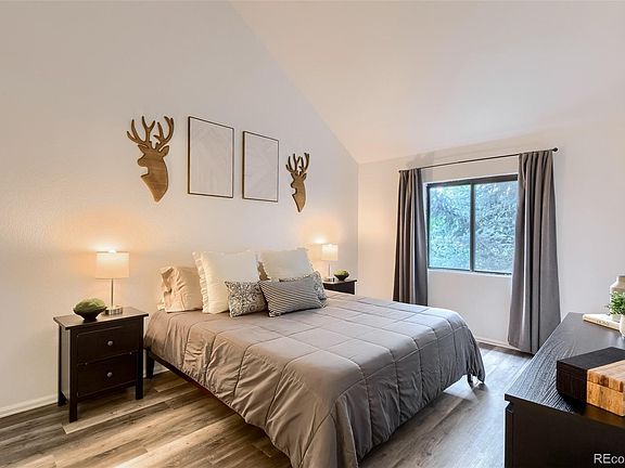 Master bedroom with large walk in closet & vaulted ceiling