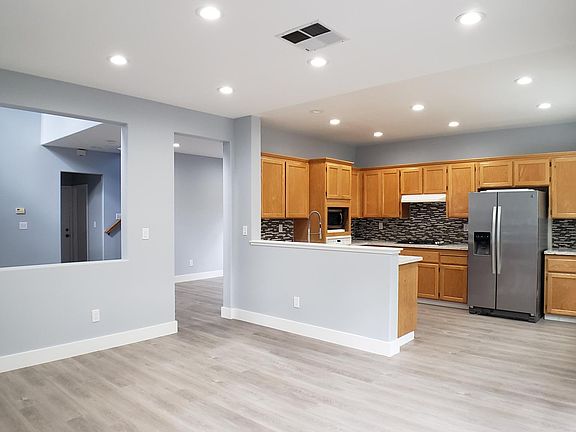 View from Family Room into Kitechen with stainless stell appliances