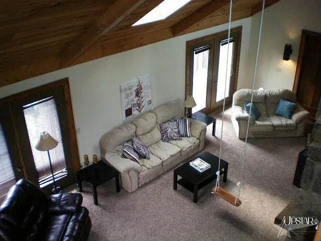 Swing was removed for previous tenants but hooks are still there if you have kids who would like to swing in their giant great room. Two sets. of French doors leading to the deck.
