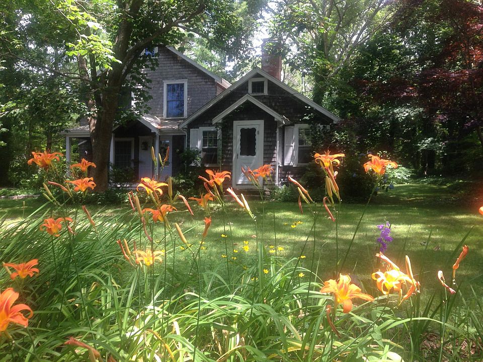 1940s cottage (dark shingles) on right attached to new addition (grey) on left. Cottage part has small living room with working fireplace, a small bedroom and an small office room.