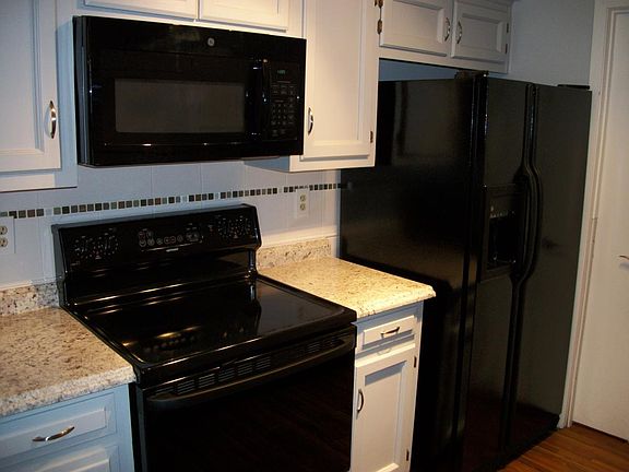 Glass-top range, above-range microwave, French door refriger