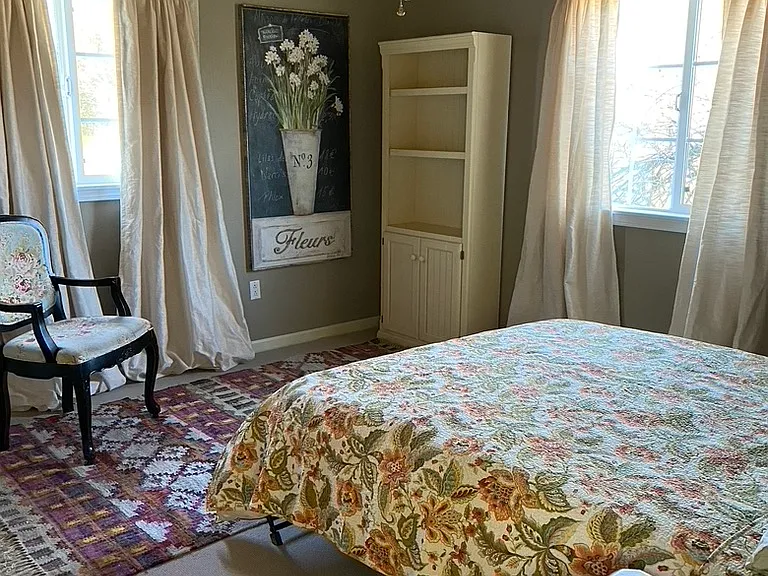 Bedroom off living room has a small bathroom with shower and private entrance