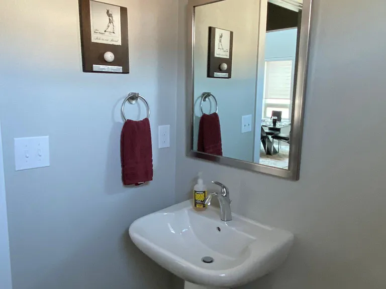 Powder room near kitchen and living room - toilet is just to the right