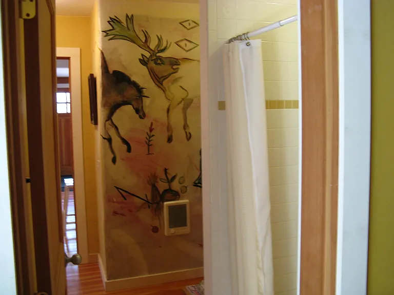 share a downstairs bath with shower that also open to the kitchen and acts as powder