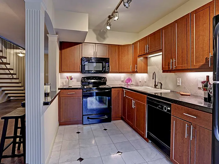 Kitchen. It has a private patio off the kitchen