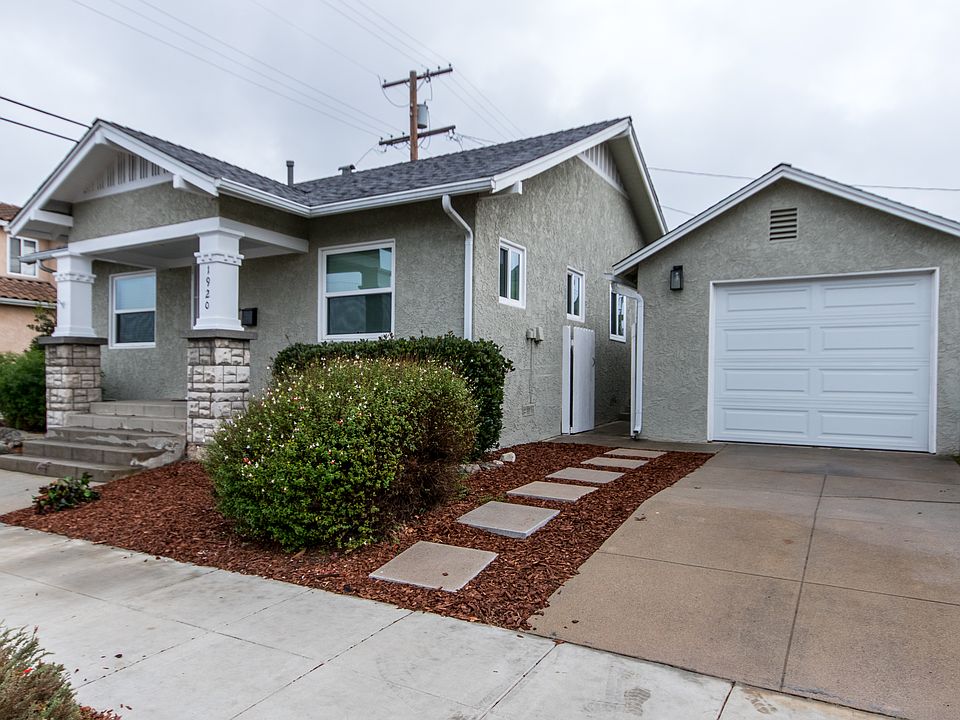 Exterior of home, front yard and one-car garage and driveway