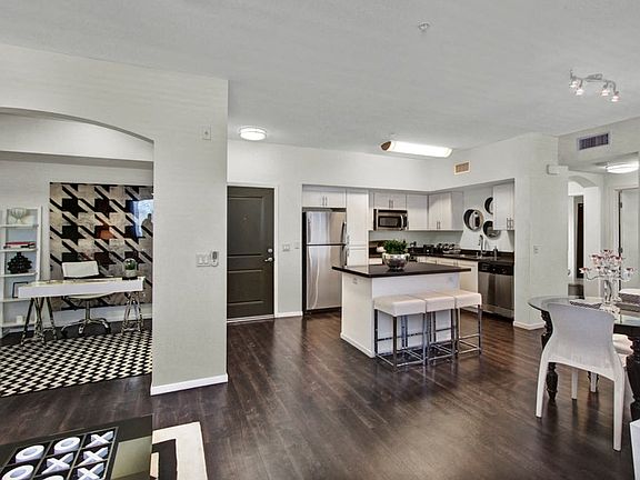 Gorgeous High End Features Connect this Kitchen, Dining, and Living Room