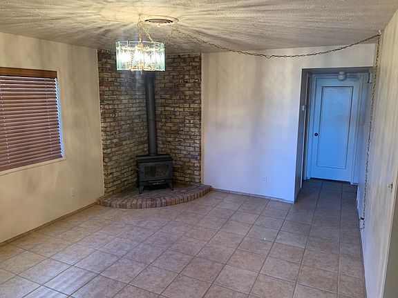 Dining/family room has a wood burning stove for ambiance or additional heat.