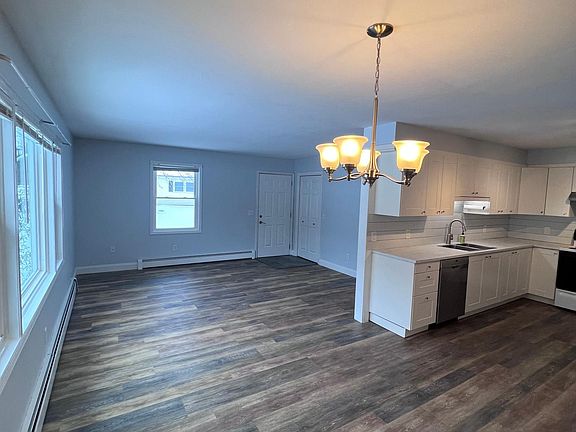 Open concept kitchen, dining, and living area.