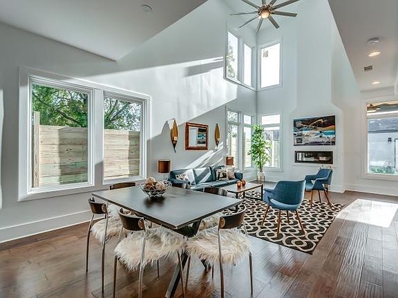 Living room with 20 ft ceilings and lot of natural light