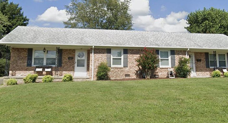 Front of the duplex with a personal driveway.