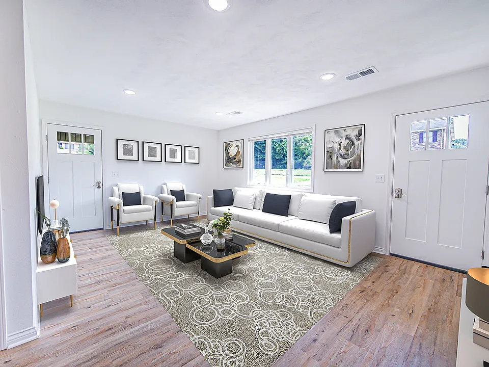 View of Living Room from the Kitchen Area. This is virtually staged to show residents the possibilities.