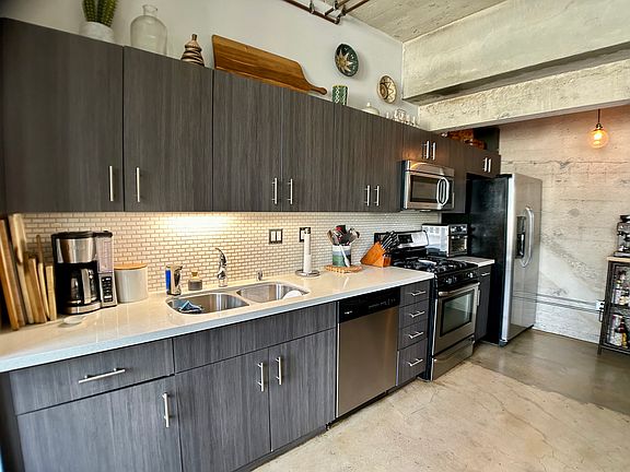 Large kitchen with gas range and plenty of storage