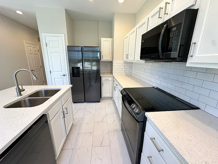 Modern new black stainless steel appliances