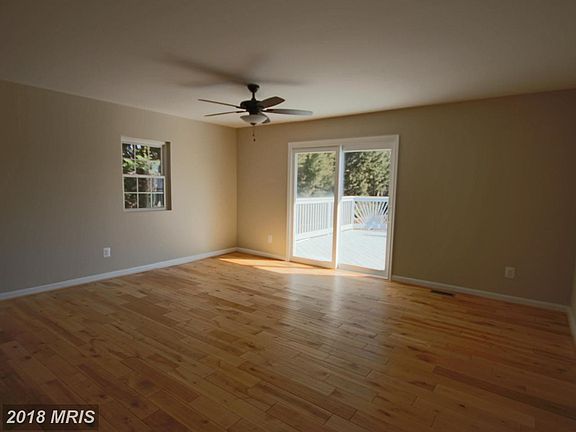 Living Room w/wood floors & sliders to deck