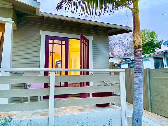 Double doors open to private porch with view