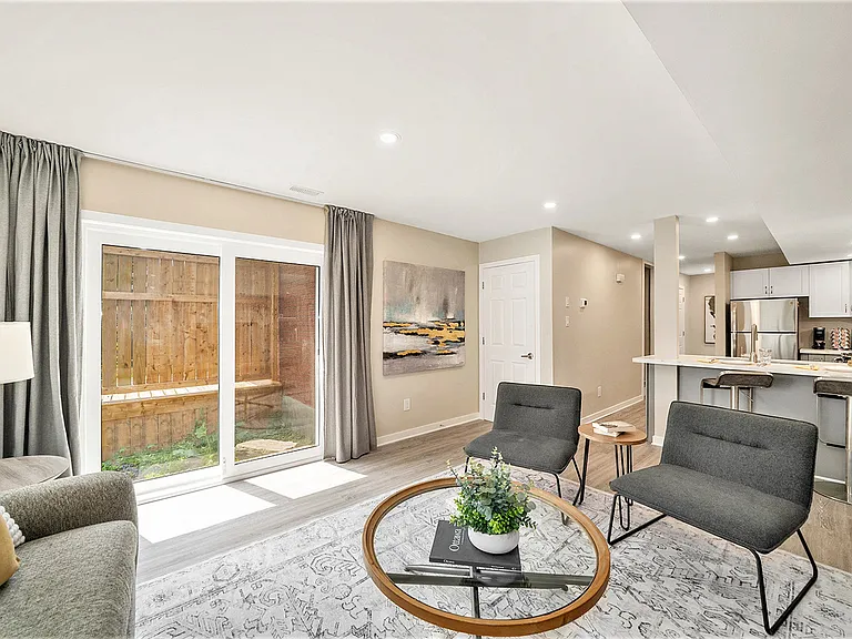 Versatile living room with direct access to the outdoor area of our Ottawa rental.