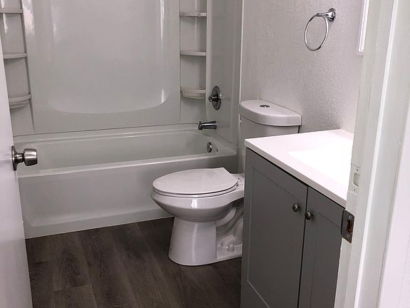 Upstairs bathroom with shower over tub.
