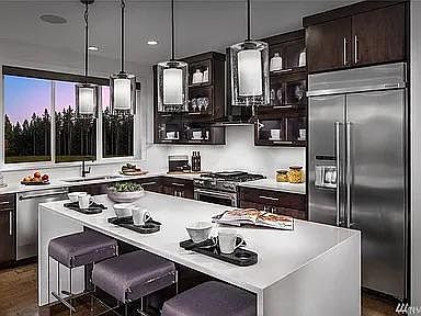 Kitchen with Smart refrigerator, microwave, air fryer, Keurig, plates and dishes.