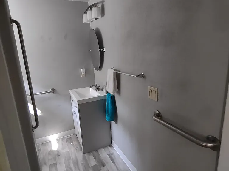Hall bathroom tub and shower.