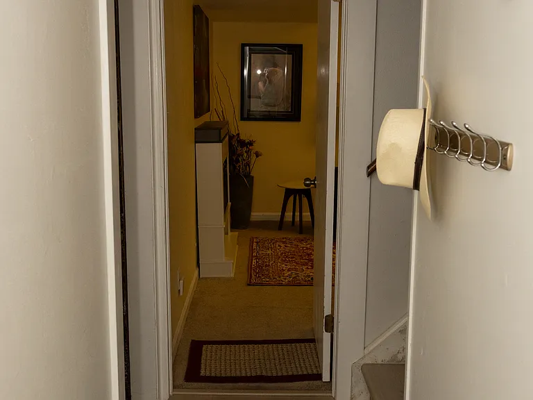 Entrance is through the garage, which is the left door in this photo.