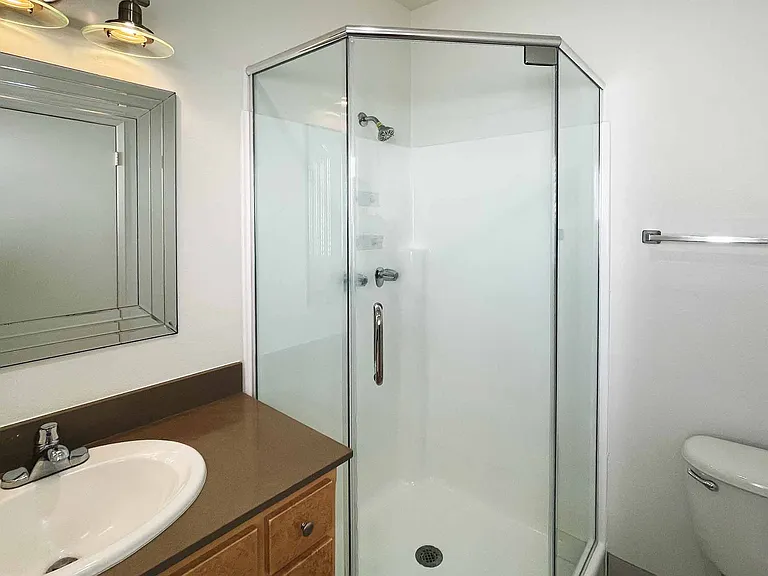 Spacious, tile-less showers are easy to clean and maintain