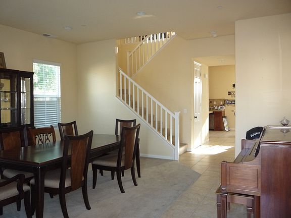 Living Room with previous tenant furniture before new painting