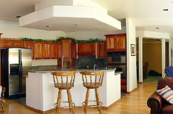 Great room open and bright with views of hillside and open space.