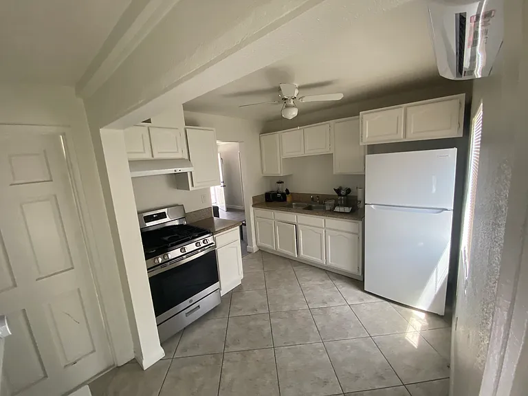Recently remodeled kitchen, brand new cabinets and floor. Brand new fridge and washer/ dryer unit.