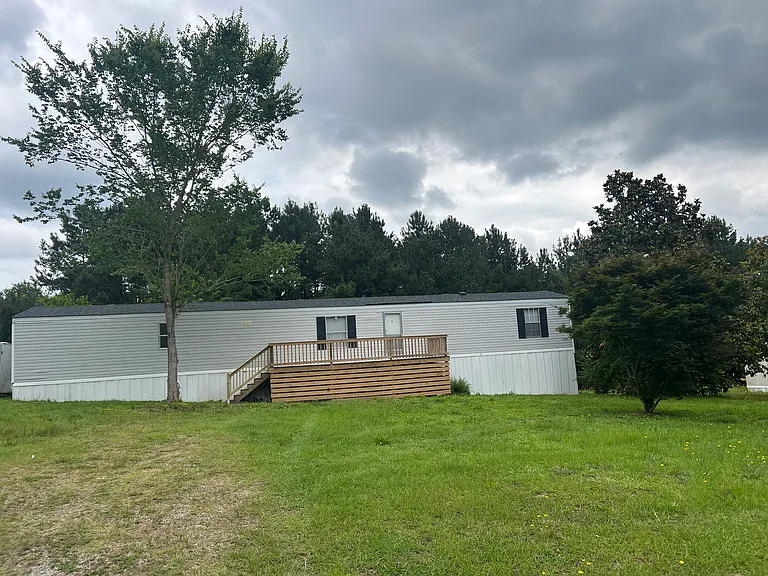 Large front yard set off from the road