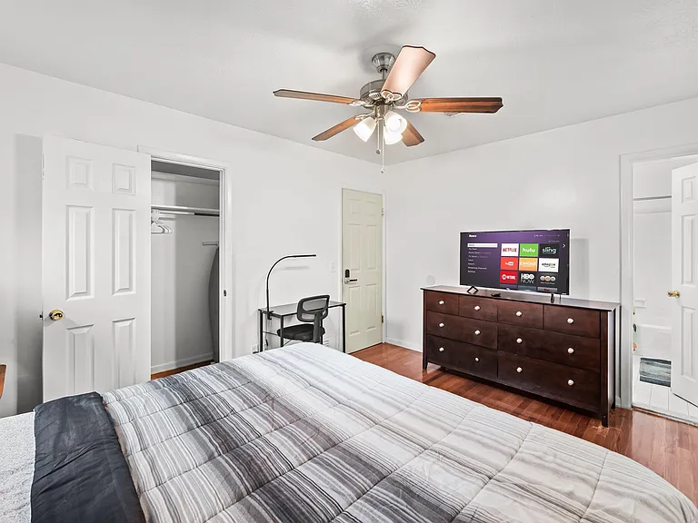 Private Bathroom - Large master bedroom with 40' TV, large closet, desk & chair, dresser, mirror and night stand