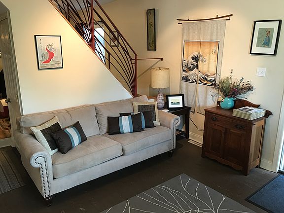 Living room with stairs behind