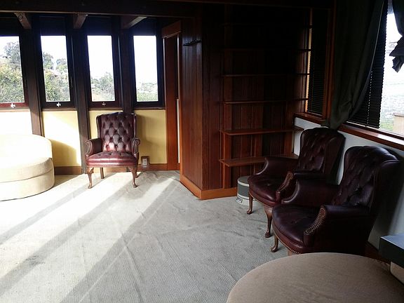 View of San Gabriel Mountains with snow and Valley below, form North windows. Carpet was replaced by hardwood flooring and new kitchenette is under North windows. Chairs can stay or be removed. Bed can be furnished.