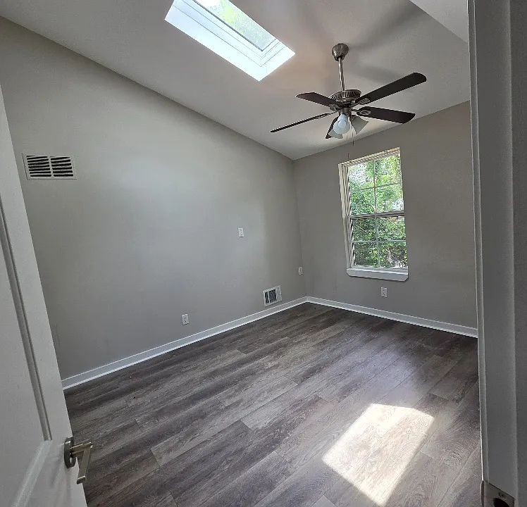 Nice main bedroom with rare skylight AND vaulted ceiling!
