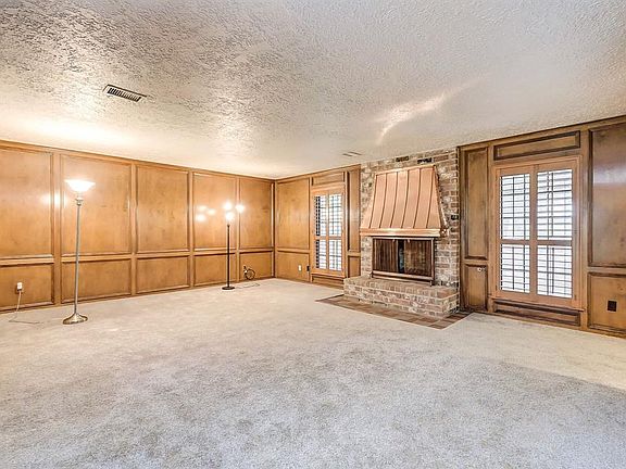 Plantation shutters set this room off along with the masonry fireplace and copper hood.