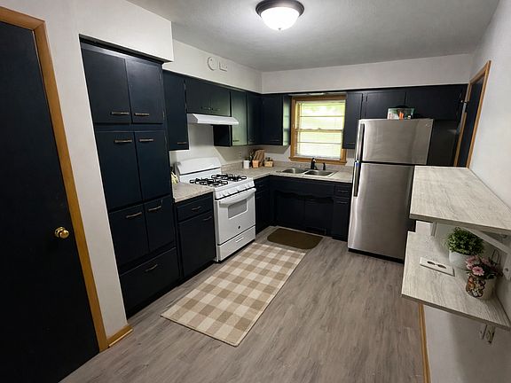 Spacious kitchen view with great natural light from the window, plus plenty of room to move around while cooking