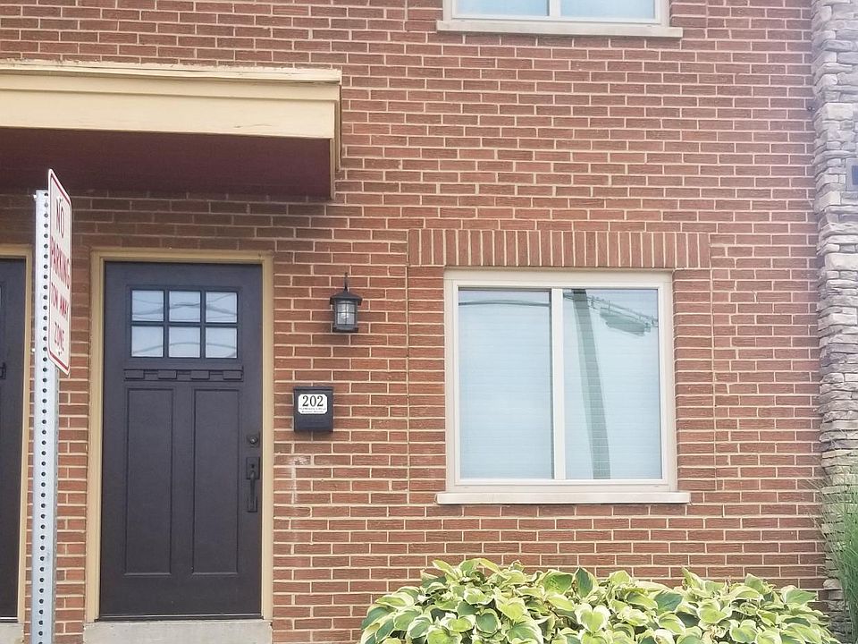 Front entrance next to parking lot at end of building