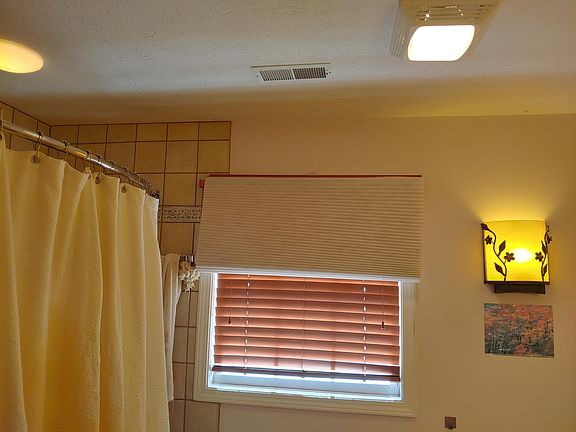 Master bath with lots of light fixtures