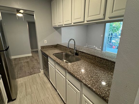large counter space for appliances and food prep with a deep sink and brand new, super quiet dishwasher