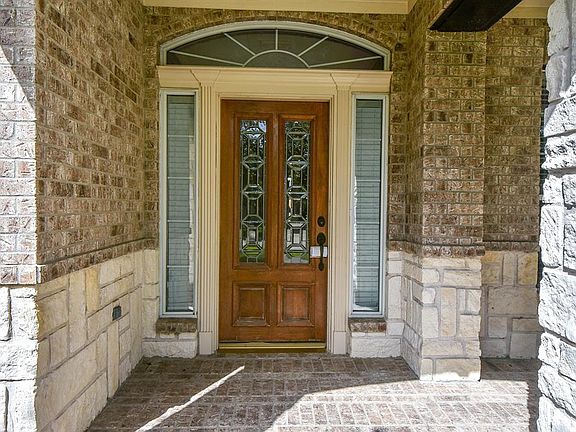 Bricked entryway and attractive door