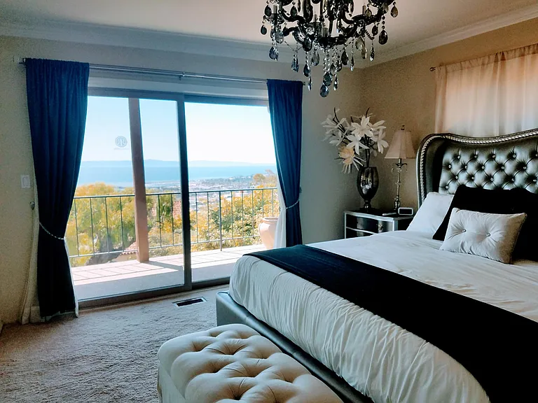 Ocean and harbor views from the gorgeous primary bedroom